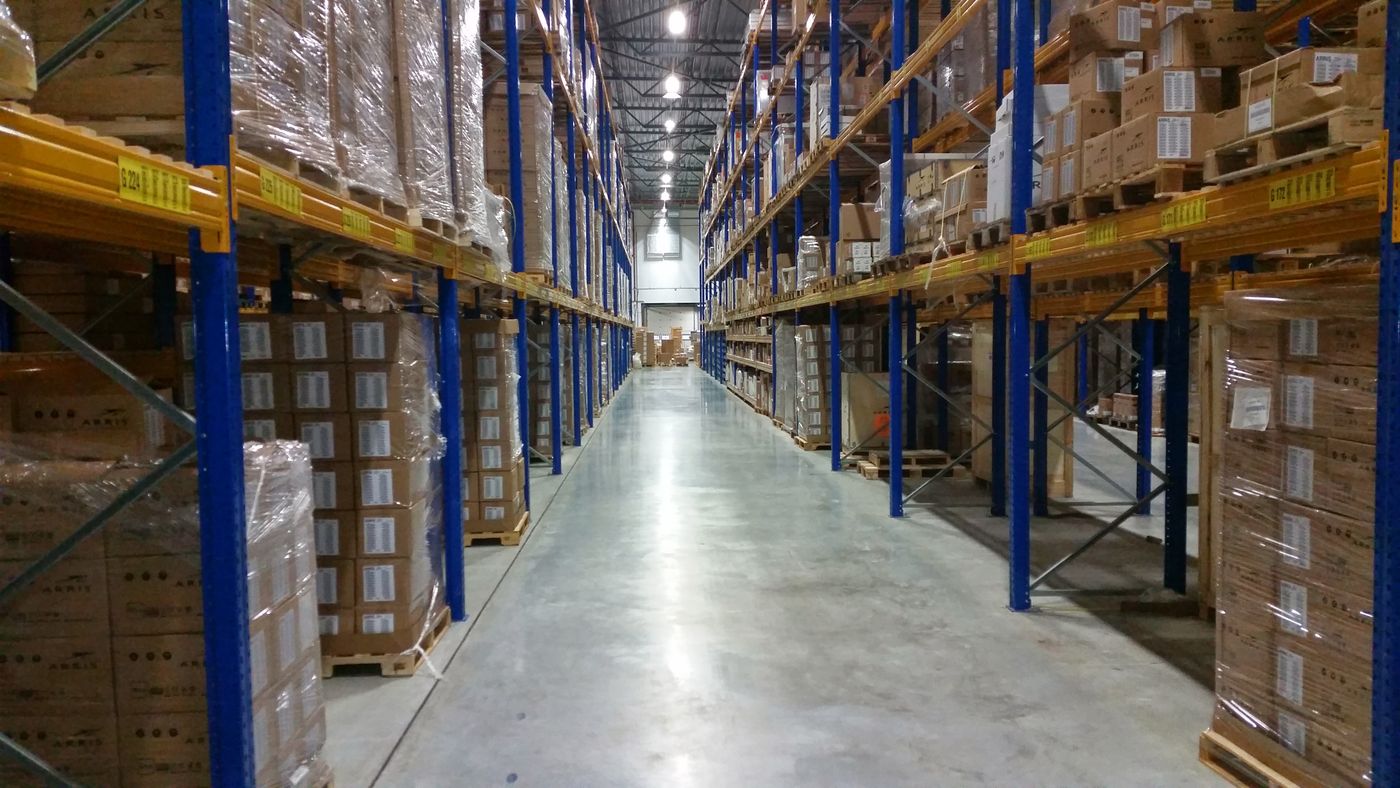 Warehouse aisle with stocked pallet shelving