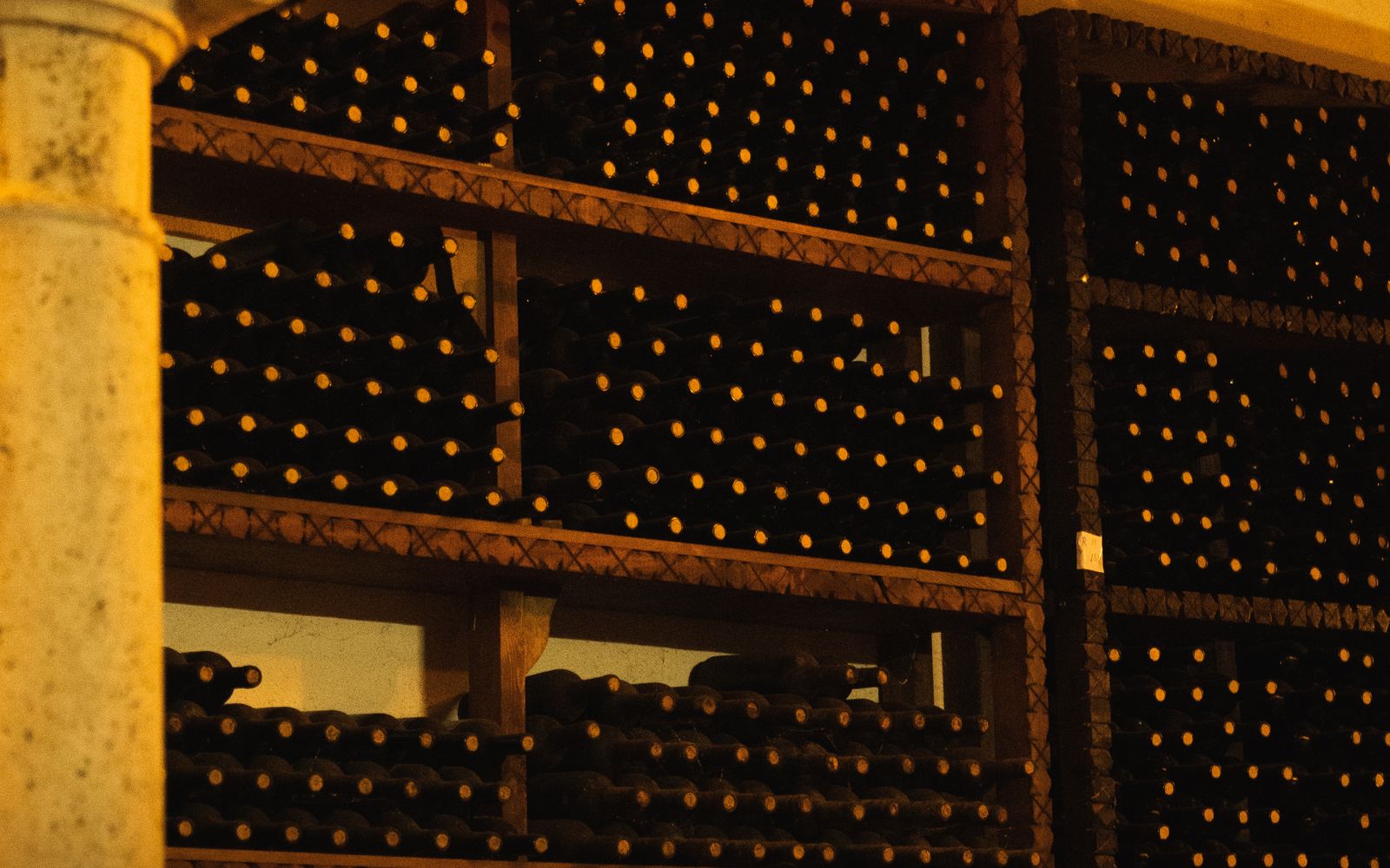 Rows of wine bottles in a hospitality cellar
